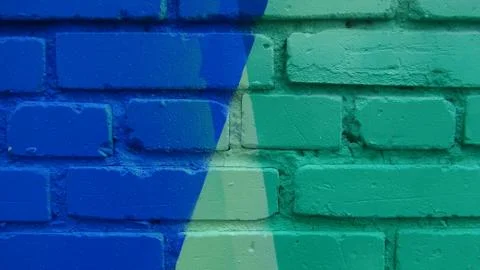 Brick wall painted in different bright colors 写真素材