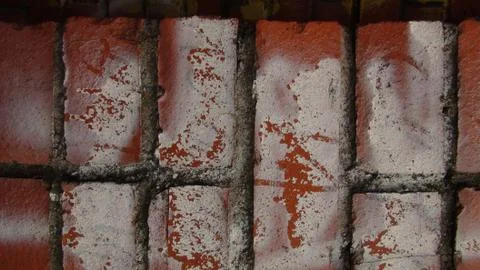 Brick wall painted in different bright colors Stock Photos