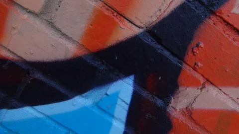 Brick wall painted in different bright colors Stock Photos