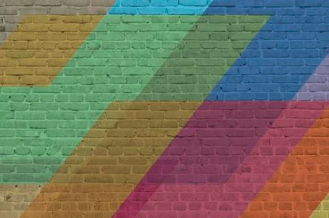 Brick wall painted with multi-colored paints. Abstract background.  Stock Photos