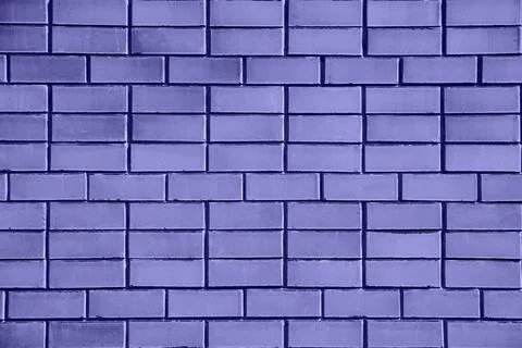 Brick wall painted with paint surface for background. Brick wall. Close-up. Old Stock Photos