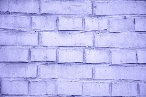 Brick wall painted with paint surface for background. Brick wall. Close-up. Old Stock Photos