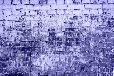 Brick wall painted with paint surface for background. Brick wall. Close-up. O Stock Photos