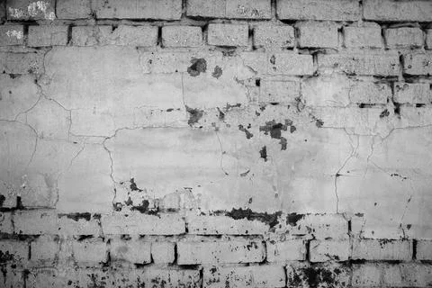 Brick wall painted with paint surface for background. Brick wall. Close-up. Old Foto stock