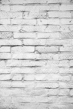 Brick wall painted with paint surface for background. Brick wall. Close-up. O Stock Photos