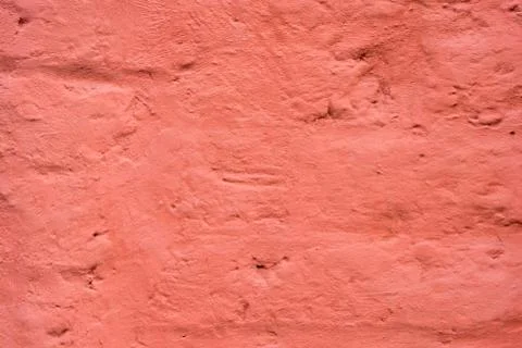 Brick wall painted with thick red paint Stock Photos