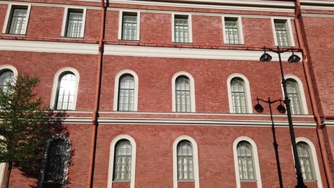Brick wall. The point of view of the person who walks along the red brick bui Stock Footage 169745411