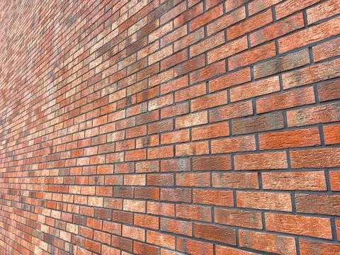 Brick wall with rectangular bricks arranged in a pattern showing different .. Stock Photos