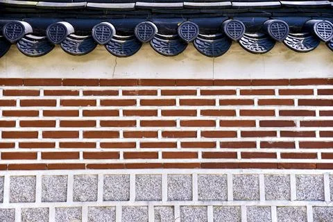 A brick wall with a red brick border Stock Photos