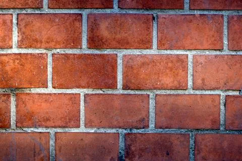 Brick wall red masonry with cement joints. Gray seams between carmine textu.. Stock Photos