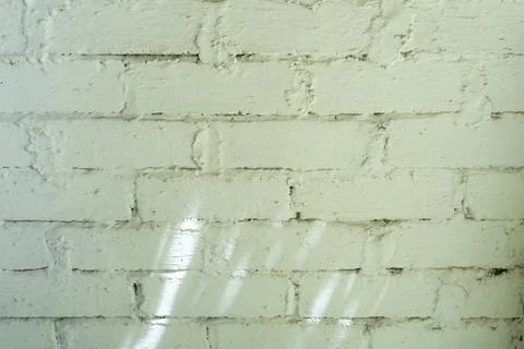 Brick wall with a rough texture and a few holes Stock Photos