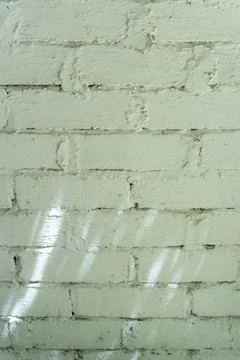 Brick wall with a rough texture and a few holes 스톡 사진