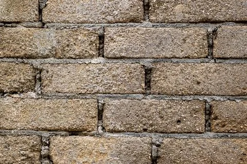 Brick wall with a rough texture and a few holes Stock Photos