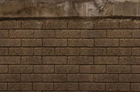 Brick wall is showing flat design style with brown textured bricks, recessed Stock Photos