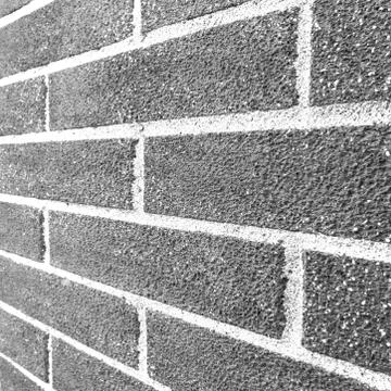 Brick Wall Side Angle Black and White Foto stock
