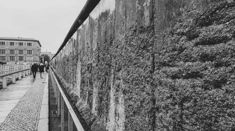 Brick wall by sidewalk Stock Photos