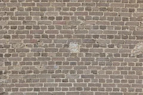 Brick wall with a sign Stock Photos