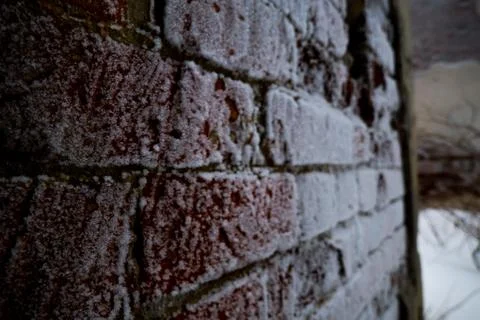 Brick wall in snow Stock Photos