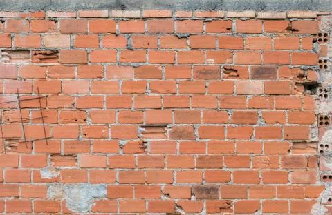 Brick wall with some broken and pieces of over exposed iron Stock Photos