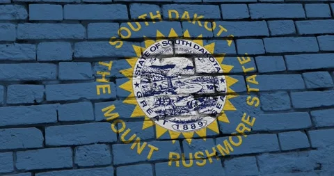 A brick wall with the south dakota state flag of the United States of America Vídeos de archivo 337431333