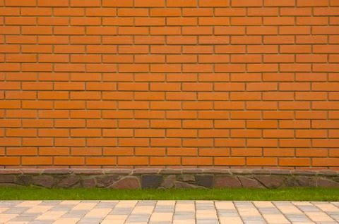 Brick wall with a stone border Stock Photos