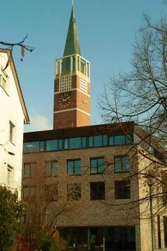 Brick Wall, Stone Path, Tall Trees and Church Tower, German Town Stock Photos