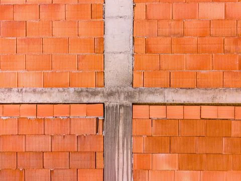 Brick wall structure with horizontal and vertical lines in an unfinished bu.. Stock-Fotos