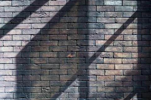 Brick Wall with Sunlight and Shadows Stock Photos