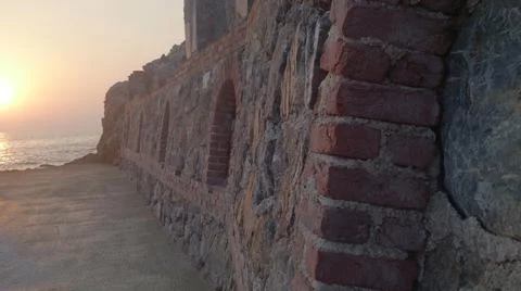 Brick wall at sunset, background Stock Photos