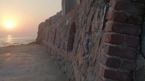 Brick wall at sunset, background Stock Photos