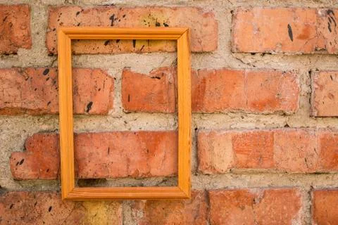 Brick wall texture background with picture frame. Foto stock