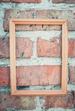 Brick wall texture background with picture frame. Stock Photos