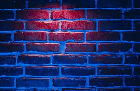 Brick wall texture background in red and blue neon lights Stock Photos