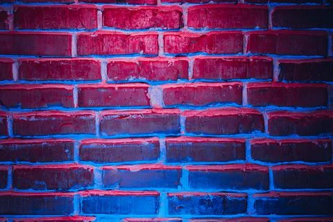 Brick wall texture background in red and blue neon lights Stock Photos