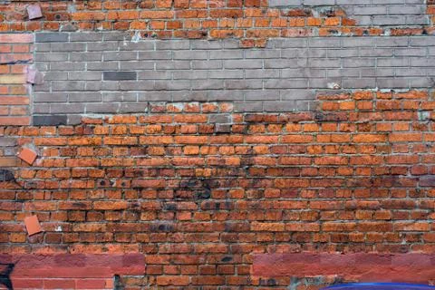 Brick wall texture of bricks of different colors Stock Photos