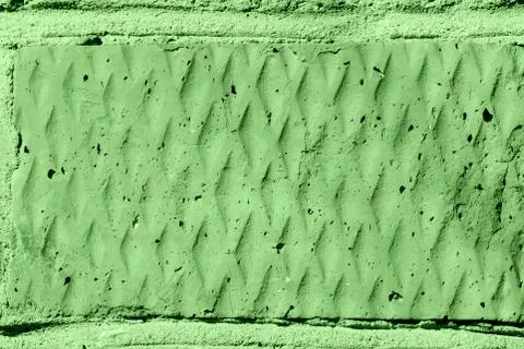 Brick wall texture close-up lit by the sun. Abstract background green color 스톡 사진