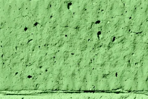 Brick wall texture close-up lit by the sun. Abstract background green color 스톡 사진