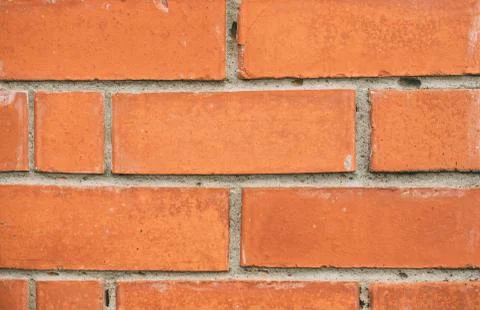 Brick wall texture close up. Orange yellow masonry macro. Stock Photos