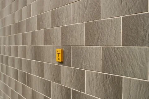 Brick wall texture, decorative stone with yellow sign Stock Photos