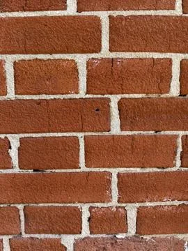 Brick wall texture with distinct red and beige color pattern, ideal for arc.. Stock Photos