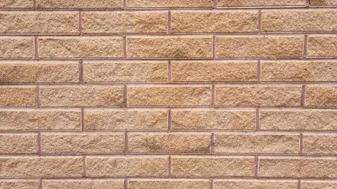 Brick wall texture with horizontal pattern in warm beige tones Stock Photos