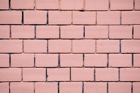 Brick wall as a texture in light beige tone. Stock Photos