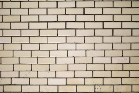 Brick wall. Texture of masonry. Light brick. Repeating elements. Stock Photos