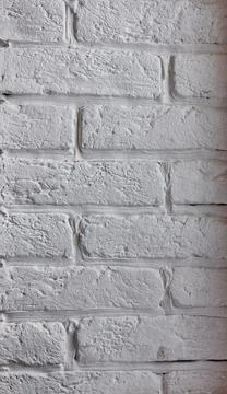 Brick wall texture painted in white paint Stock Photos