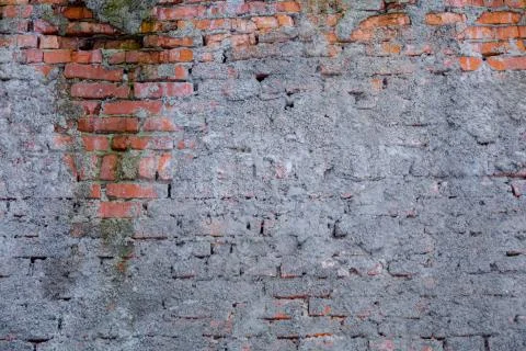 Brick wall texture partially plastered Stock Photos