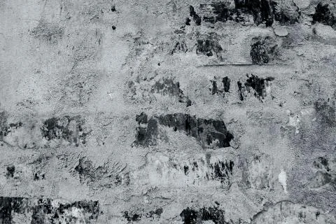 Brick wall texture partially plastered 写真素材