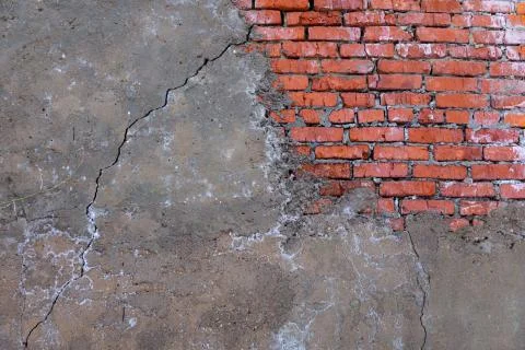 Brick wall texture partially plastered Stock Photos