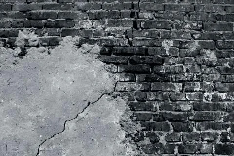 Brick wall texture partially plastered Stock Photos