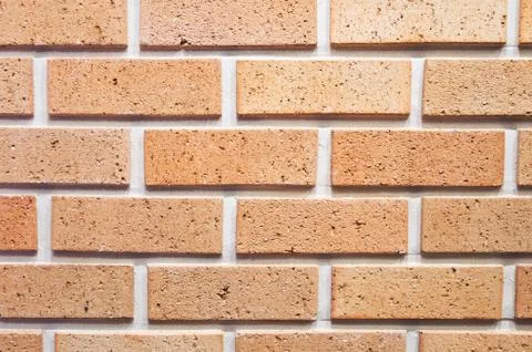 Brick wall, texture of red stone blocks closeup Stock Photos