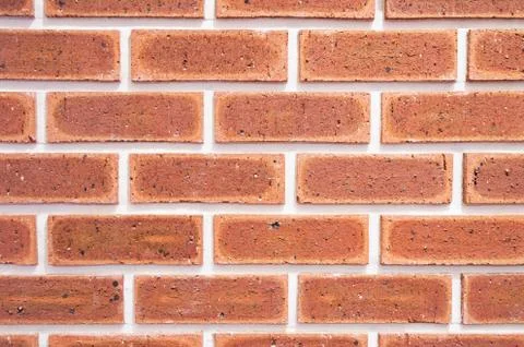 Brick wall, texture of red stone blocks closeup Stock-Fotos